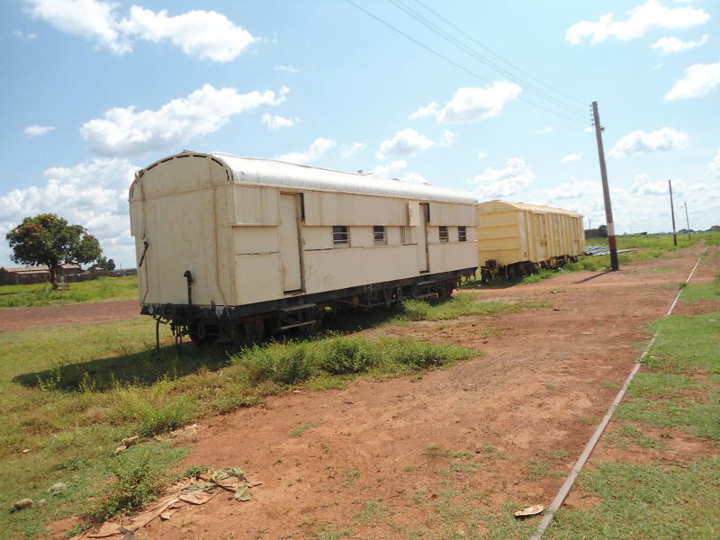 A pair of vehicles standing in the station