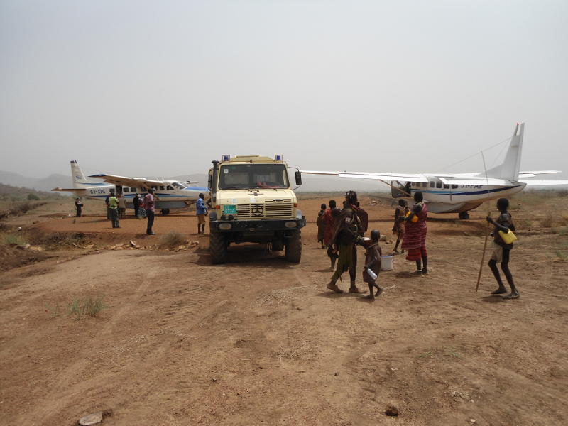 An unusually busy day at Kuron airstrip, with two Cessna Caravans and a Unimog. We had five flights that day, four with the Caravans and one with a UN helicopter, lifting out well over 50 guests.