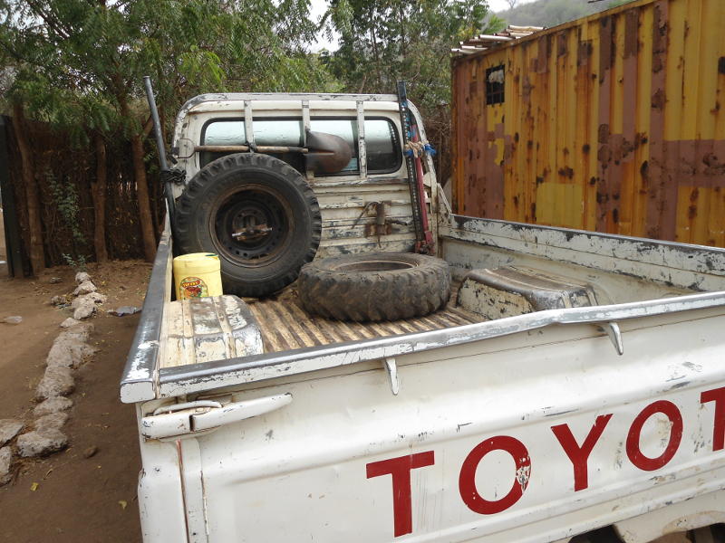The equally ubiquitous Land Cruiser pick-up (bakkie to South Africans), with the essential kit - two spare tyres, a high lift jack, a shovel and a jerrycan of something