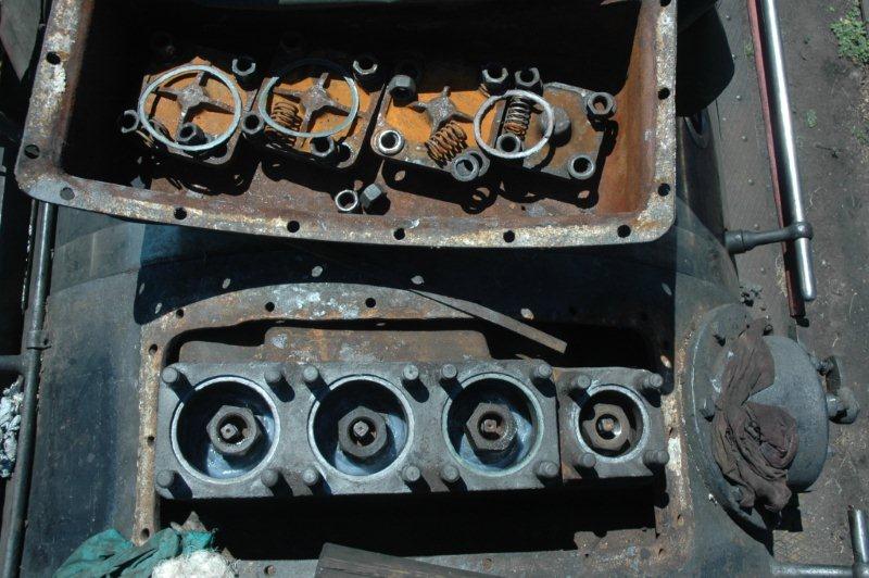 The complete regulator set of valves including the smaller Pilot valve on the right with covers, ready for closure. The pilot valve opens first when the regulator is opened and then steam will be admitted in a sequence to the other valves.