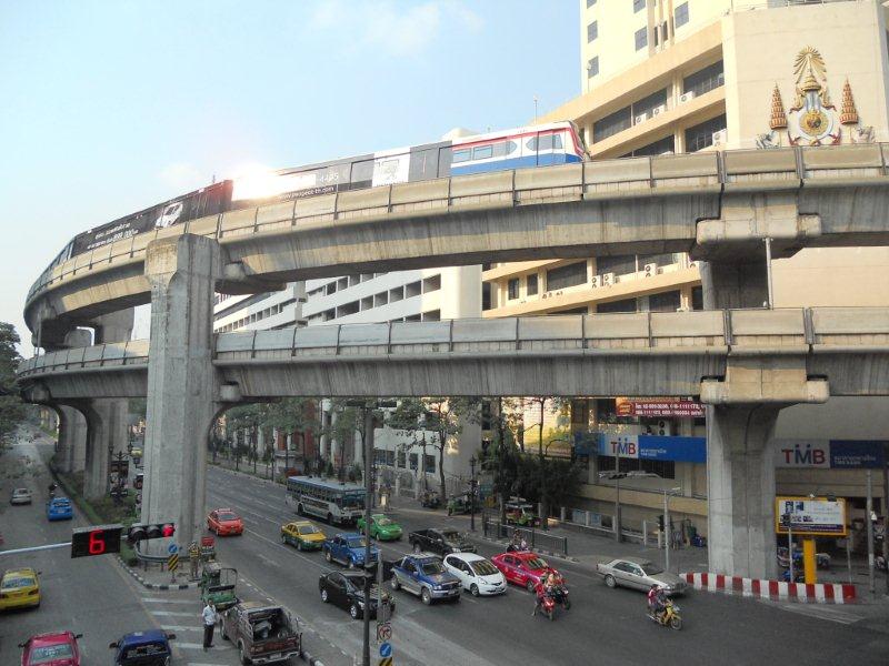 The BTS Skytrain system in Bangkok traverses the main city area with two links. Here can be seen a commuter set on the top level near to the very touristy area of Pratunam. This BTS system is also connected to the Airport Link at Bangkok's main airport.