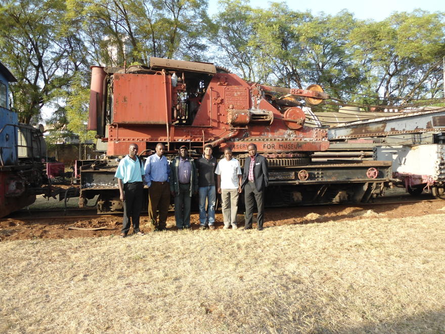 FORM members pose proudly in front of the large steam crane recently rescued for the museum