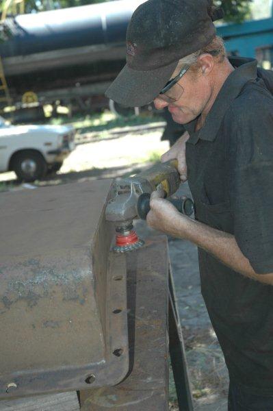 Spikkels prepares the regulator valve cover for painting.