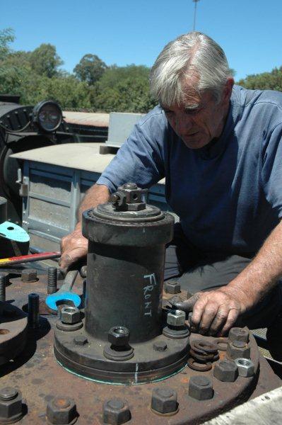 John Dadford tightens up the bolts on the first safety valve in place after the hydraulic test.