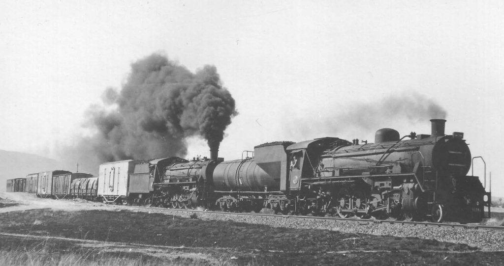 Double header class 19D nearing Swartspruit on a late afternoon mixed to De Moot to collect sand which is excavated there. The lead locomotive, albeit with a long tender, is in fact 2650 which is one of FOTR's mainstay locomotives. She finished her SAR service when withdrawn with a short box tender. 1979
