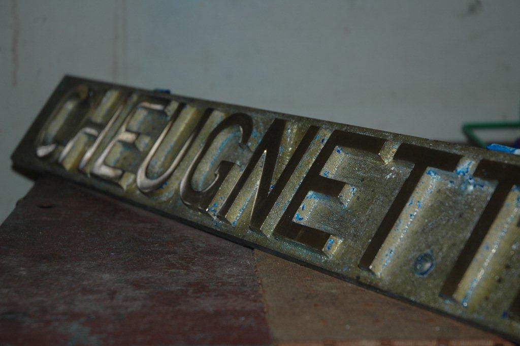 CHEUGNETTE nameplate is now cleaned of all the old paint and now will be wiped clean with thinners. Then a release agent will be painted onto the lettering that must remain as visible brass, whilst the rest will get the paint on it that will form the background.