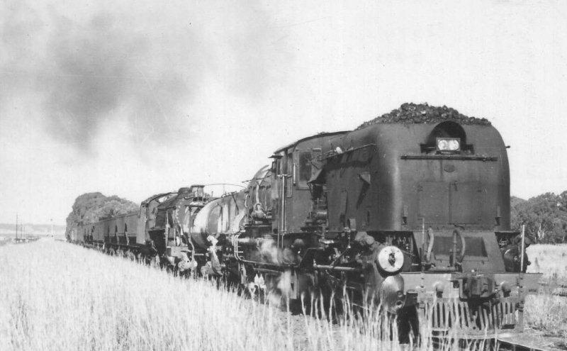 During loco transfers and workings to the Koedoespoort shops, there were often some unusual loco combinations. Here is a GO Garratt number 2594 with a 15CA number 2813 approaching Rayton from the East. 12 July 1972