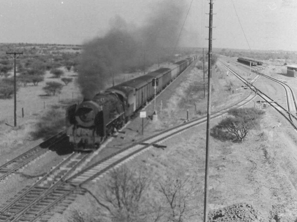 Not a good shot at all due to negative problems, but a 15F heading Northbound, passing the new yard at BABELEGI not far from Pretoria. This was an industrial development in the then homeland of Bophutatswana. Today this yard is deserted and most of the rails lifted. 1972
