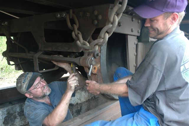 It's not just sbout locomotives. Coaches need attention too. John Ashworth in the pit puts the final touch to the brake block replacement, while Dewald Heydenrych looks pleased that the task is over. <br /><br />Photoe by Nathan Berelowitz 09/02/08