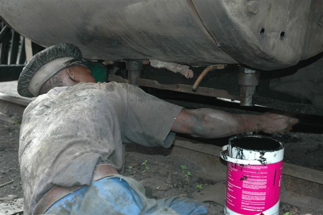 Nataniel at work, painting up the15F. <br /><br />Photo by Nathan Berelowitz 09/02/08