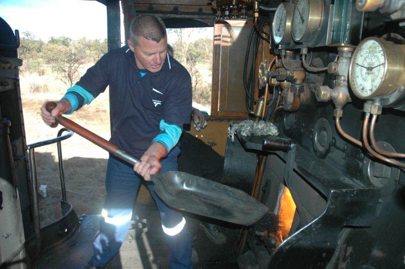 You cannot keep an ex steam man away from the shovel! The pilot for the day flicks in a few shovelfuls, while Tony takes a break.