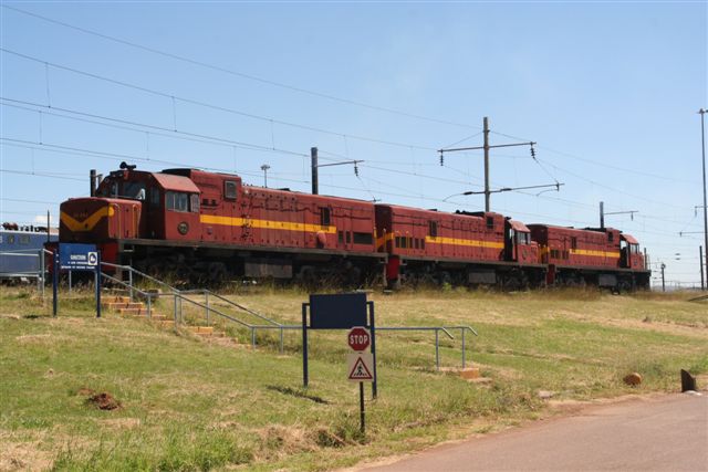 Class 33 diesels make regular stopovers at Pyramid South, en route to and from various hire contracts in Africa. Here on a lazy Sunday afternoon 10 Feb 2008, pioneer locos 33-002/6/9 stand ticking over at the running shed.