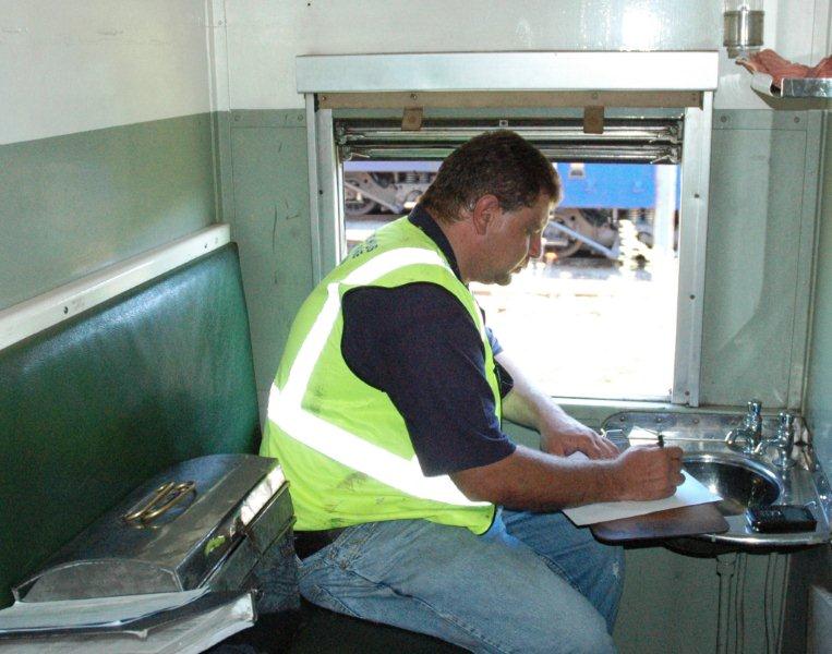 Gabor Kovacs performs his Guard duties from the caboose