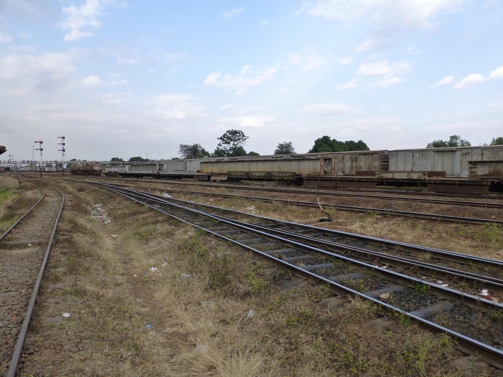 A number of wagons standing in the yard are carrying old girders recovered from various parts of the network