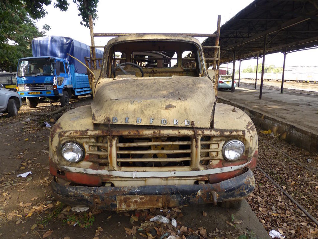 A derelict Bedford lorry is parked on the platform