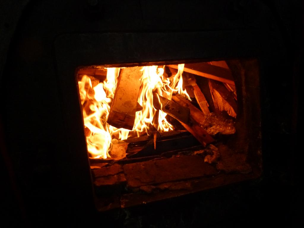 The fire has just been lit. Actually the people who prepped the loco had packed so much wood into the firebox that it wouldn't burn properly so we had to rake some of it out