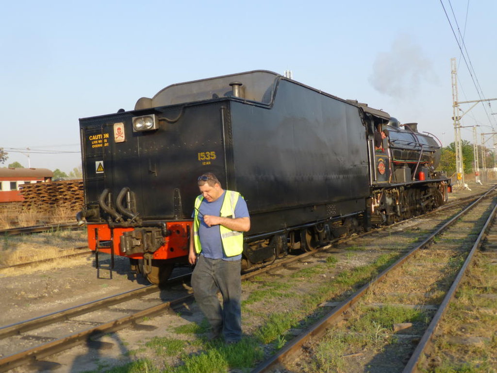 Guard Gabor walks alongside the tender as the loco sets back to couple on.