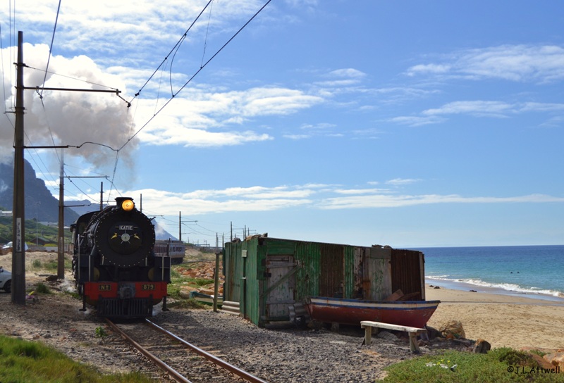 With Simons Town station just a few hundred meters ahead, 879 slowly makes her way past a local fisherman's shack.