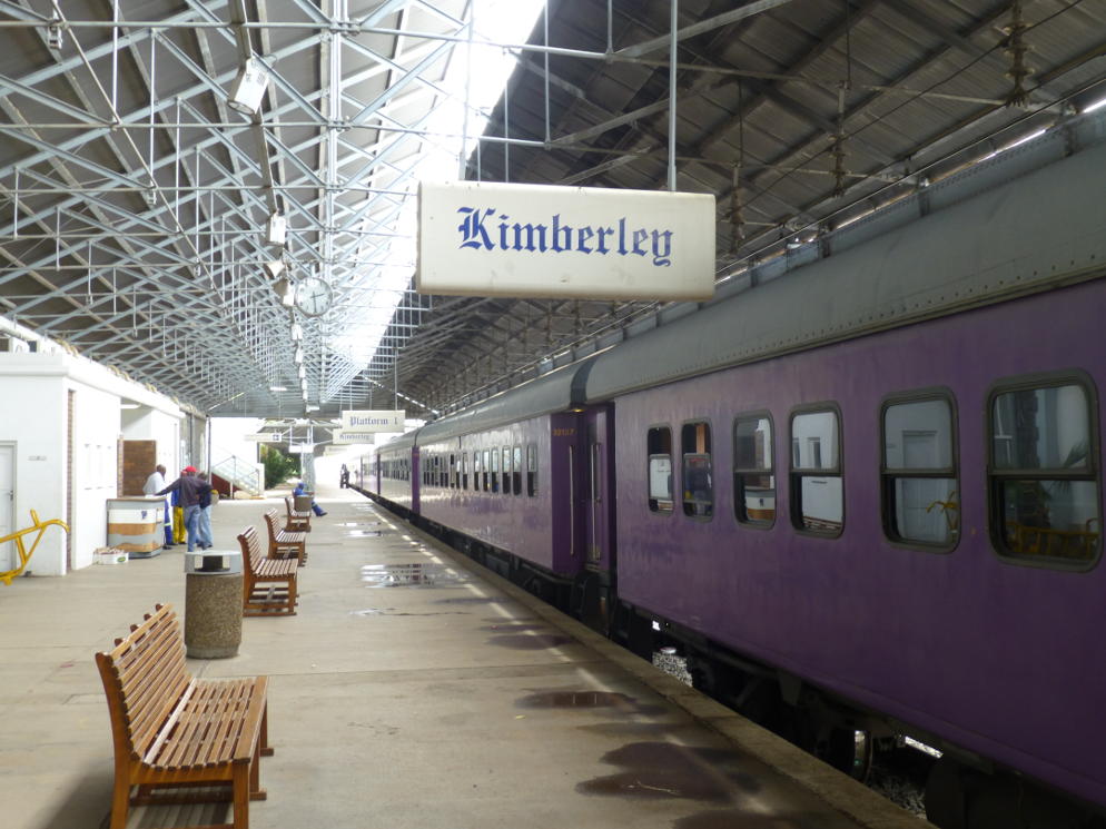 The Premier Classe train stands in Kimberley Station early on a damp grey morning.