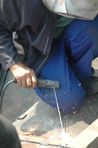 John Dadford welds away on the tender of the 15F 3117. Work is nearing completion and soon it will be coal, not sparks, that will lie here.