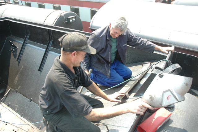 Work on the tender of 3117 class 15F is nearing completion. John Dadford on the right gets assistance from "Spikkels" during a welding manouvre during the hot summer days of February 2008. If one looks closely, one can see the modifications that have been carried out in the coal space.
