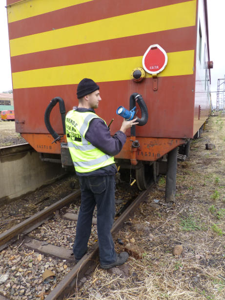 Trainee Guard Philip does the brake test under the supervision of the cameraman