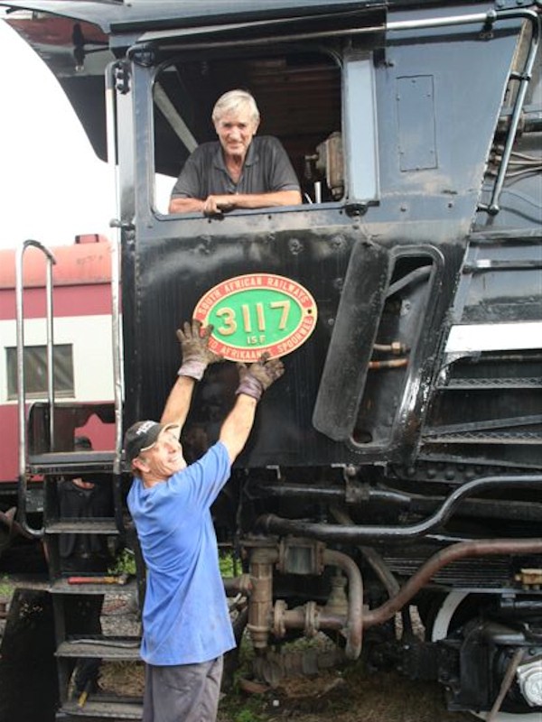 3117's numberplates have arrived! Nathan, making a surprise visit to the site, shows off the plates watched on by John Dadford.<br /><br />C Janisch