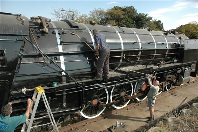 Hands on experience in pipe fitting. Early days of the restoration of 15F 3117. John on the running boards, is assisted by Tom, while Steve reaches new heights!
