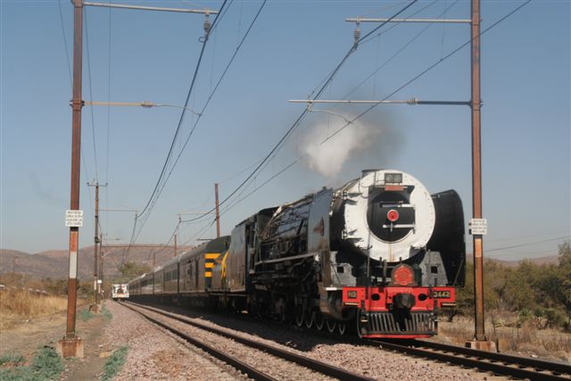 The long Rovos set crosses with a white railbakkie just south of Bon Accord<br /><br />Photo by Chris Janisch, 16/08/07
