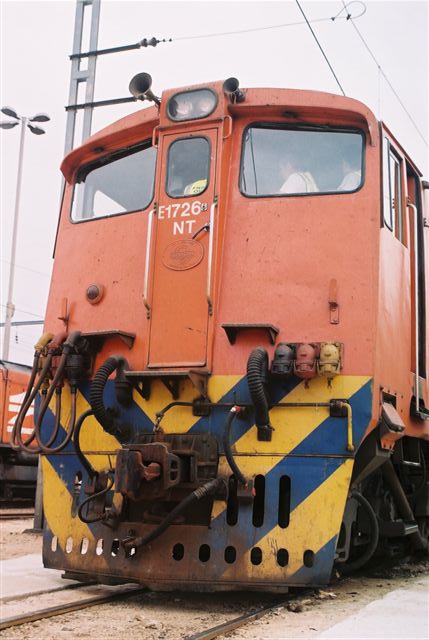 Heavy Current. The low down on a class 6E1 unit. These were buitlt by Union Carraige works, and the works plate can be seen under the paint. The NT was the region where it was based, namely "Northern Transvaal", which is now the Limpopo province. Such designations were common for years on the electrics.