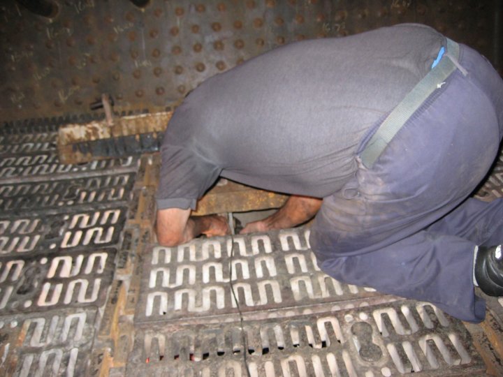 Uncle John in the firebox and Adriaan in the ashpan below connect up the last of the rocking grates