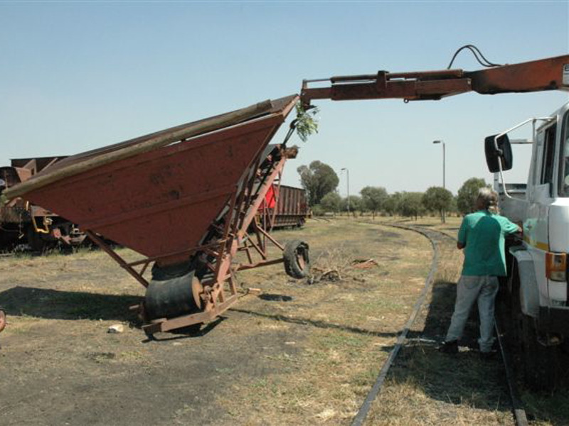 Almost level, the diamond conveyor is pulled into its temporary resting<br />place at Capital Park, prior to being moved to the new site, once the<br />perimeter fencing has been put in place. It will be painted, patched and a<br />suitable motor and wheels found for it