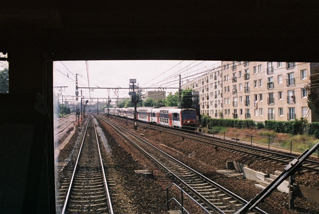 Cross Frenchies. At speeds of 120kph the double decker suburban set is being passed by an express set to Versailles. Viewed here from the cab. Speeds of 160kph were later reached.