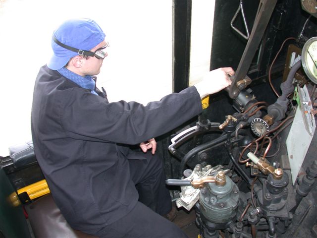 Driver on the lookout. Cab controls on the drivers side of the preserved class 141R ex SNCF locomotive, hurtling along on an excursion train. Note the brake controls and the regulator position