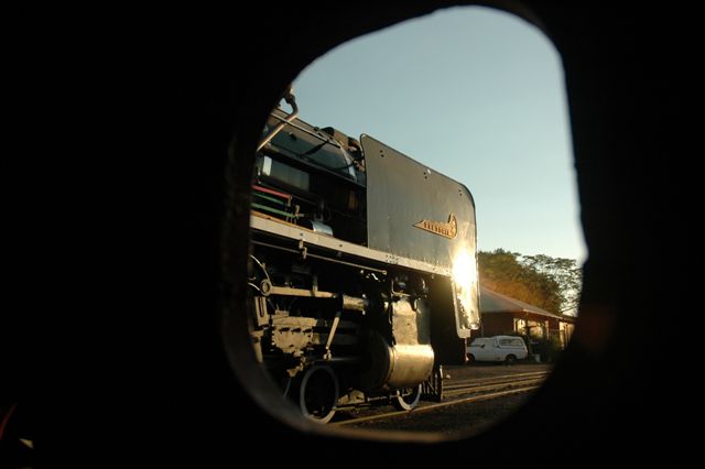 Framed 15F. Late afternoon light and a beautiful profile of the loco as viewed through a pipe hole on the buffer of the 19D 2650.