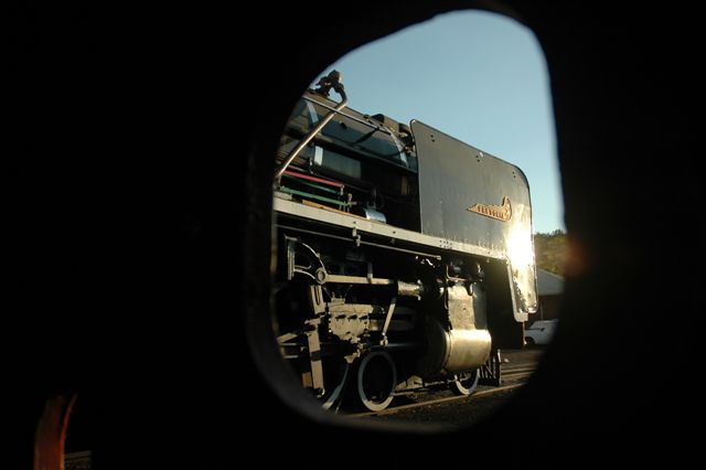 Framed through one of the holes in the buffer of 19D 2650, we see the beautiful form of 3117 as she stands alongside.