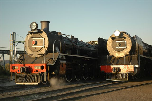 The late afternoon light in autumn, falls on the faces of two of the FOTR<br />locomotives. Soon to be commissioned 15F number 3117 stands ready but not yet complets, while her smaller sister poses alongside during a lull in a site shunt