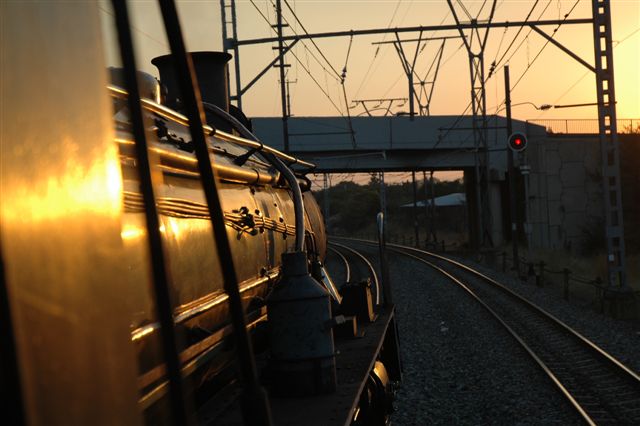 Red and gold and smoke and steam. The drivers side view from 19D 2650 heading home from a successful day trip to Cullinan.<br /><br />Photo by Nathan Berelowitz, June (?) 2007