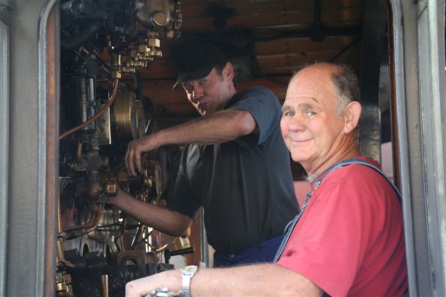 Dennis and Les cleaning the 24's cab.
