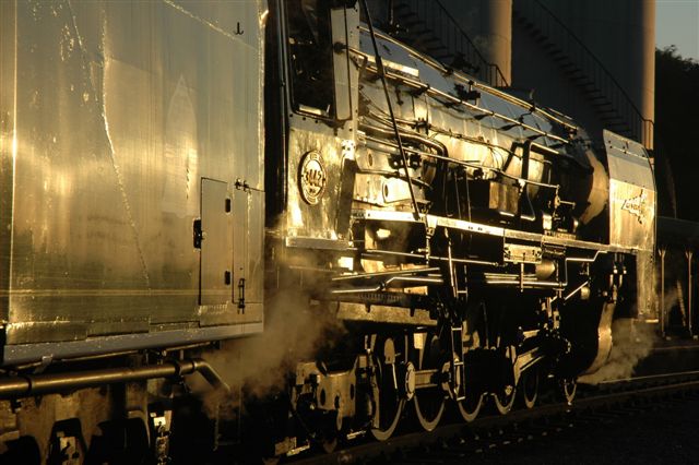 The mighty form of the Rovos Rail class 25NC stands bathed in gold, as the last minutes of an African sunset highlight the beautiful features of these magnificent locomotives.