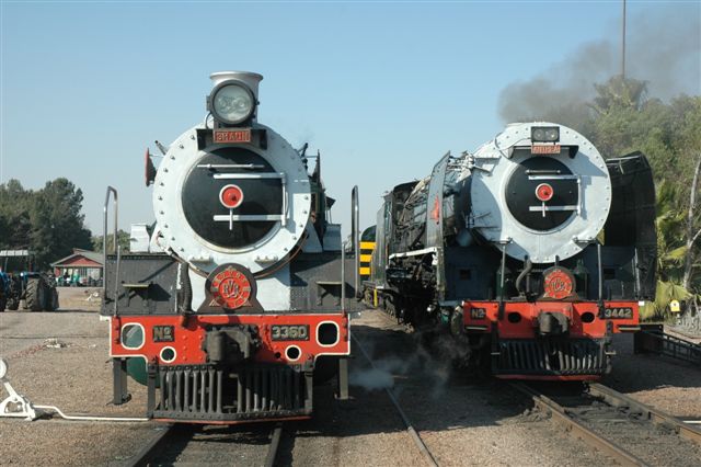 Rovos locomotives. Last operating class 19D 3360 passes 25NC 3442 at the Rovos site Capital Park. This 19D is the last of their three serviceable 19Ds