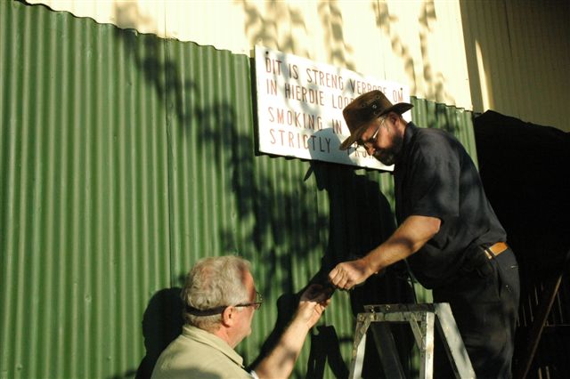 Our signage contractors, John and Tom, at work affixing the necessary warning and information signs.