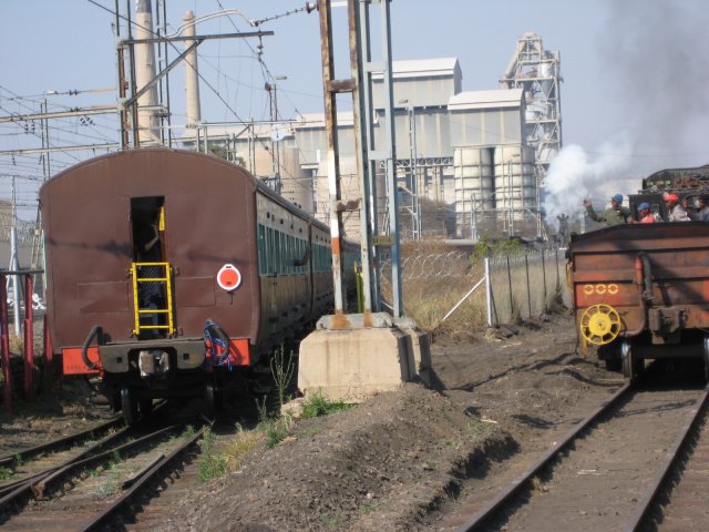 The last coach approaches the exit gate