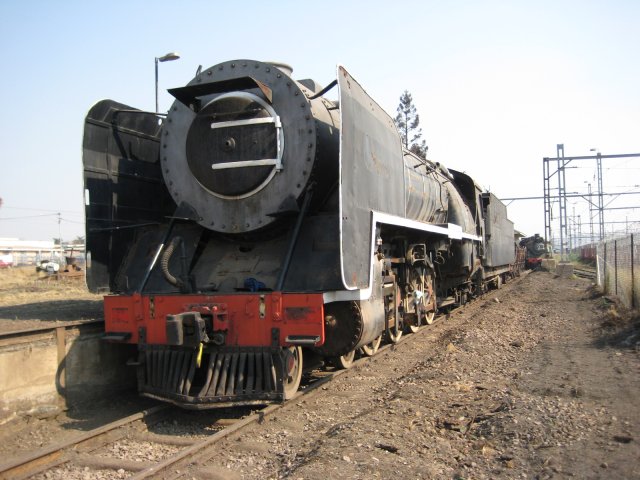 The huge 15F, with the tiny 24 which hauled her to her new home peeking out in the background