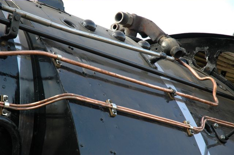 &amp;quot;EVERY LITTLE PIPE HAS SPACES, EVERY LITTLE PIPE HAS A PLATE,<br />TO HOLD IT AWAY FROM THE BOILER,<br />SO SPARKS THE PLATE WONT ATE!!&amp;quot;<br /><br />CAREFULLY FORMED AND FITTED, THE COPPER PIPES GO ONTO 3117'S BOILER. BEHIND<br />EACH NICKLEPLATED CLAMP, IS A BLOCK OF BA