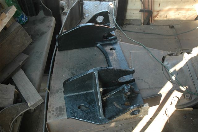 Cleaned and painted and waiting to be fitted, the firebox door frame of 3117 lies on the cab floor prior to fitting
