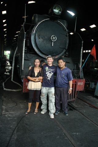 Nipa, Nathan and Nipon Thongtaree in front of 850. Nipa, an office clerk, quite liked me and insisted on exchanging phone numbers. Nipon is one of the drivers at the depot