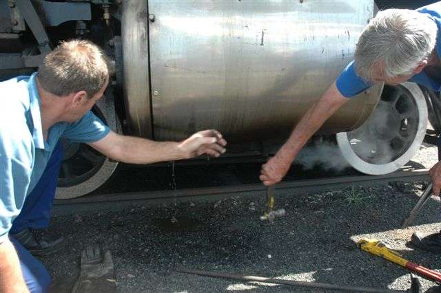 Les Weideman and John Dadford sort out blocked cylinder cocks on 3117, as she was lit up for the second time and had her safety valves set