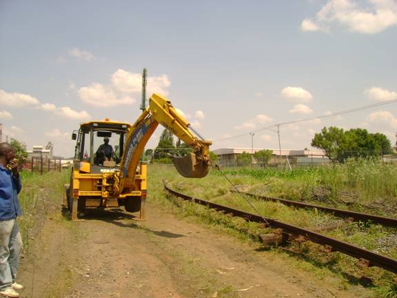 The two long continuous sections of rail have been moved into either side of the cutting.