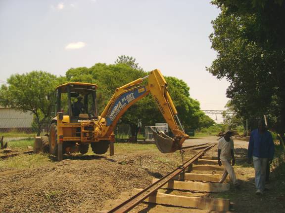 An initial section of two rails has been laid on top of the first seven sleepers.